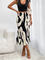 Eleganter Rock mit fließenden Falten, perfekt für einen raffinierten und femininen Look - Arlene