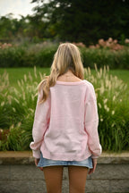 Rosa Strickjacke mit Knopfdetails